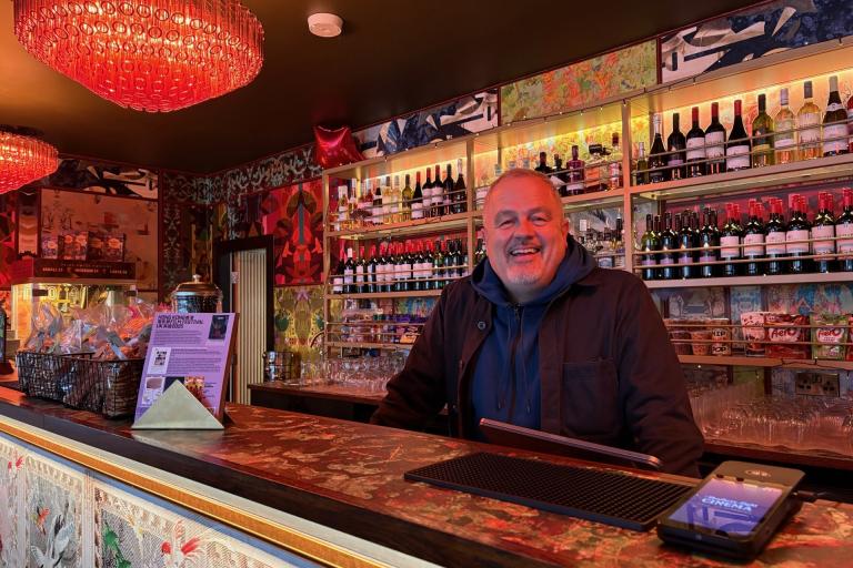 Cheery man smiling behind the bar at Northern Light Cinema in Sale