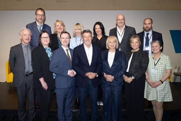 Group of people in the MDC at the launch of the Old Trafford regeneration project