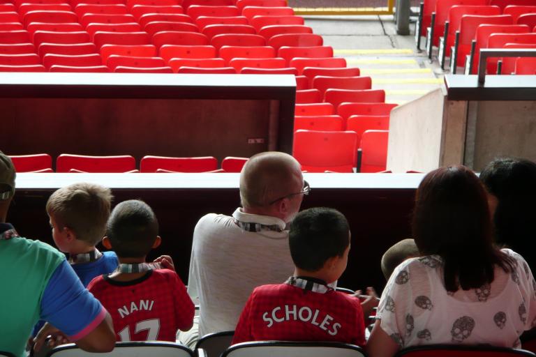 Back of a family in Manchester United Football Ground
