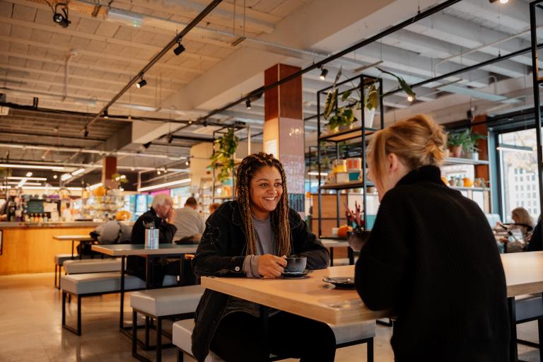 Two women sitting in cafe